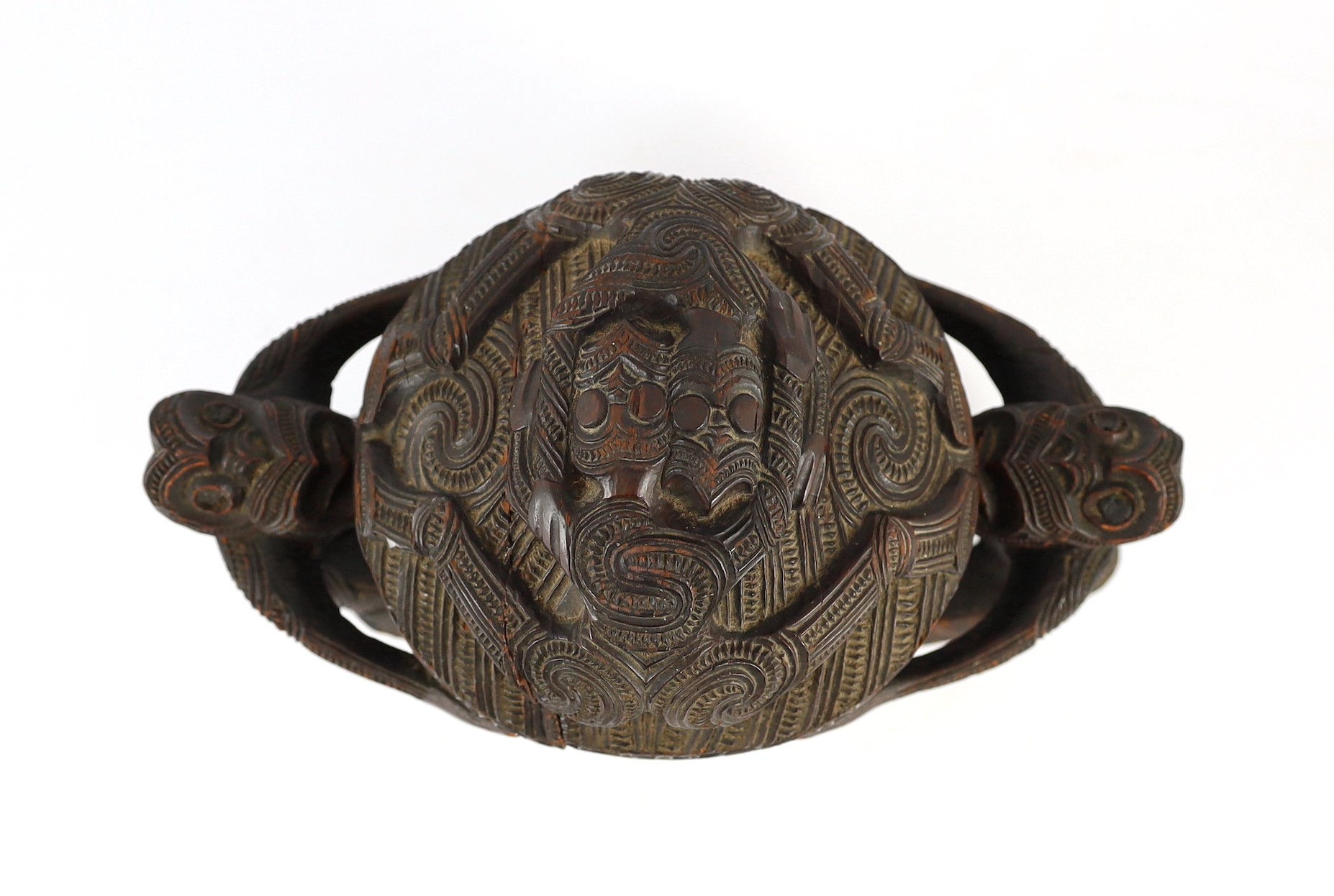 A Maori carved wood oblong bowl and cover, kumete, c.1880-1910, height 23cm length 31cm